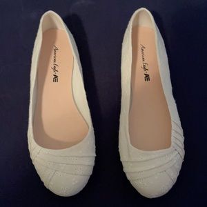 White eyelet flats